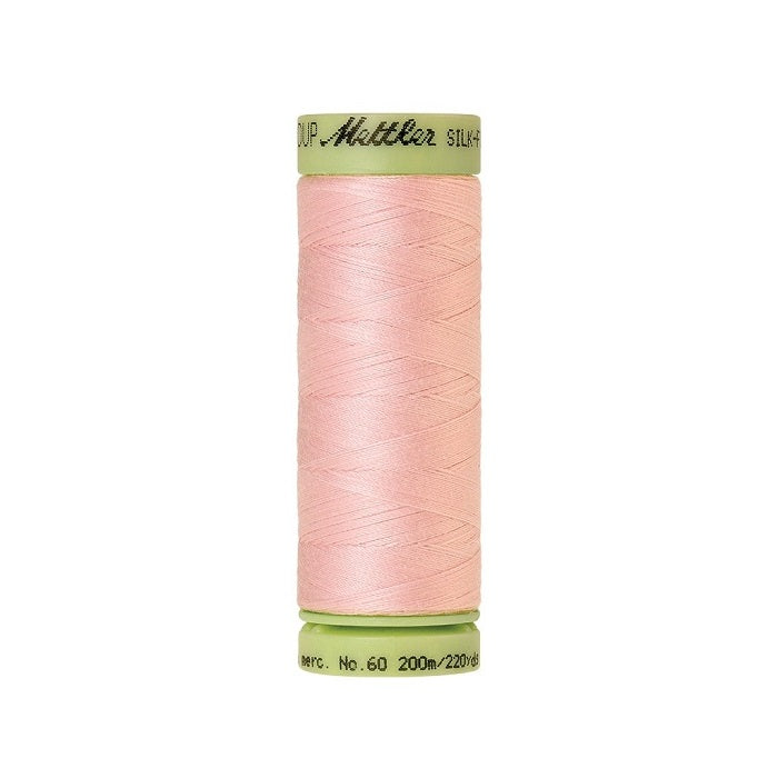 Pink thread with Mettler Cotton 60 branding.