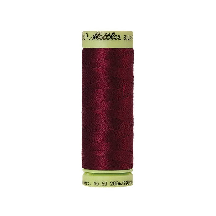 Dark red thread with Mettler Cotton 60 branding.