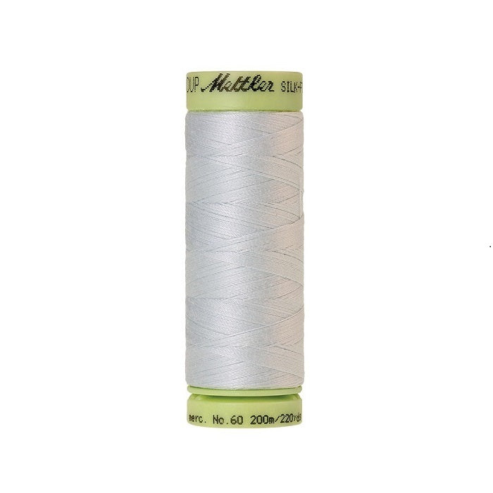 Very pale green thread with Mettler Cotton 60 branding.