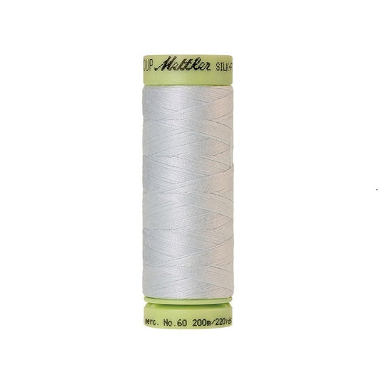 Very pale green thread with Mettler Cotton 60 branding.