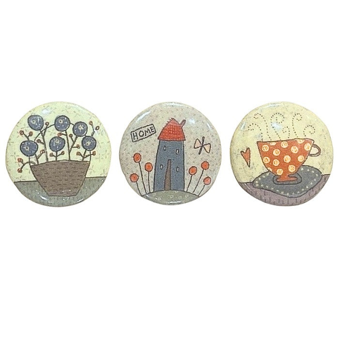 Three decorative home themed magnets.