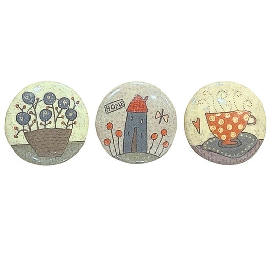 Three decorative home themed magnets.