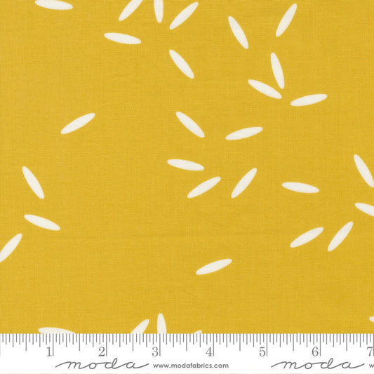 White rice pattern on a yellow background with Moda label.