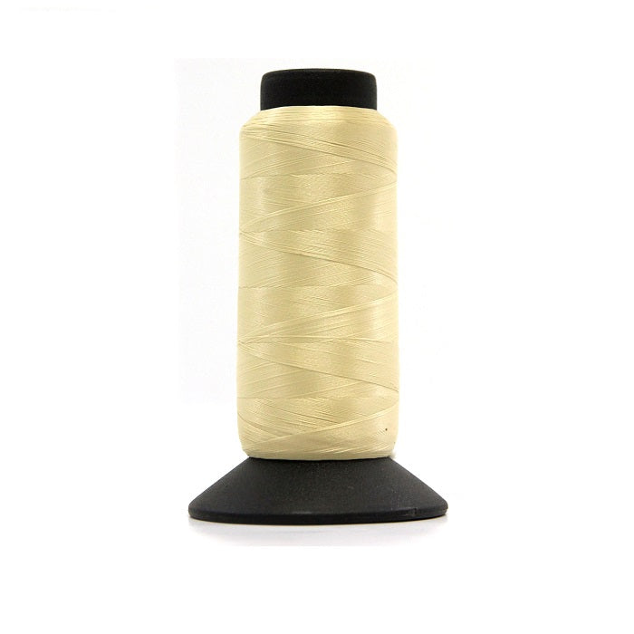 Cone of natural woolly nylon thread.