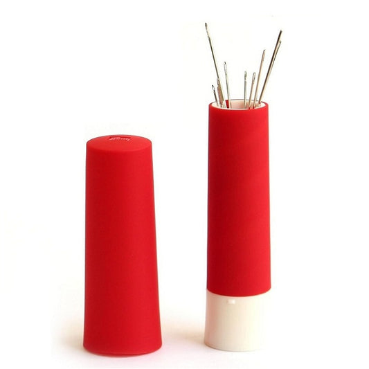 Small red cylindrical needle storage tube with lid.