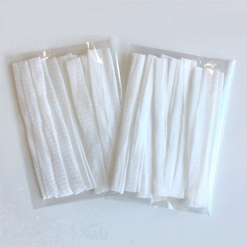 White sewing thread spool nets in a cellophane bag.