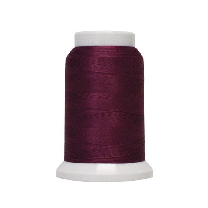 Spool of dark red woolly poly thread.