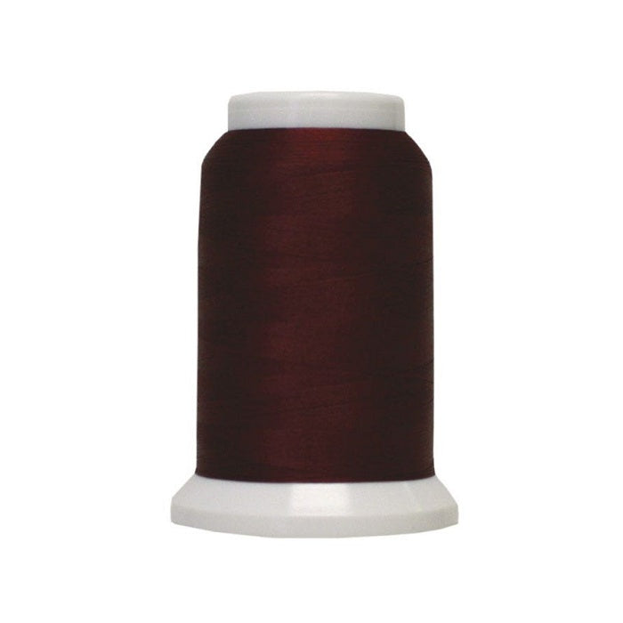 Spool of dark red woolly poly thread.