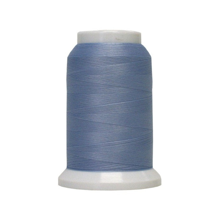 Spool of blue woolly poly thread.