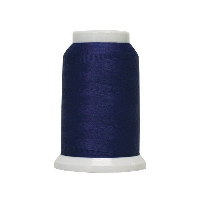 Spool of dark blue woolly poly thread.