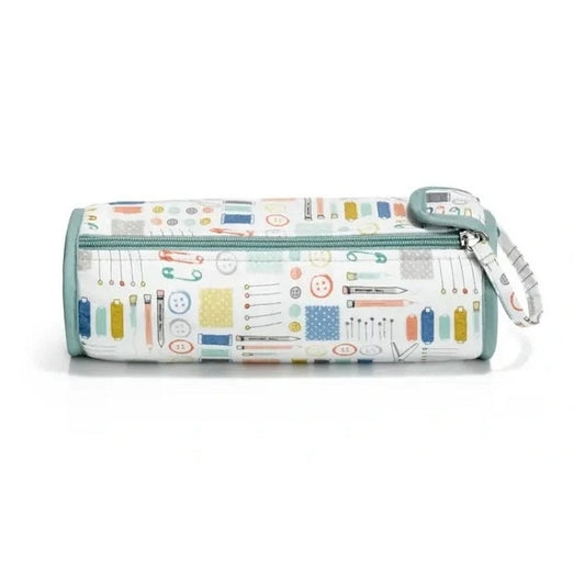Fabric crochet hook roll with sewing tools deisgn.