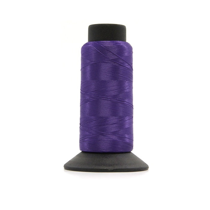 Cone of purple woolly nylon thread.