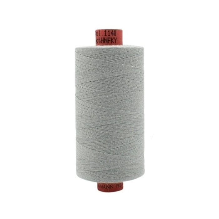 Spool of light grey thread with Rasant branding.