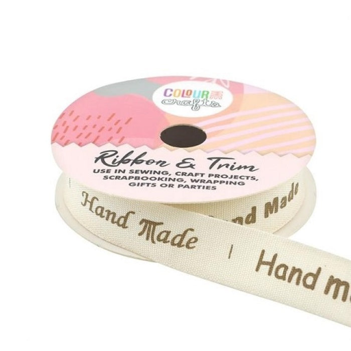Spool of natural coloured ribbon with Hand Made text.