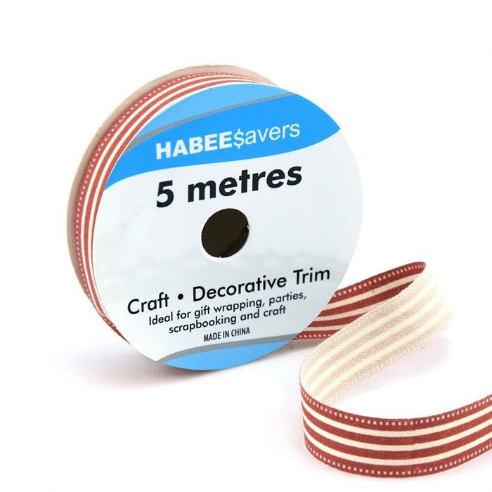 Roll of cream ribbon with red stripes.