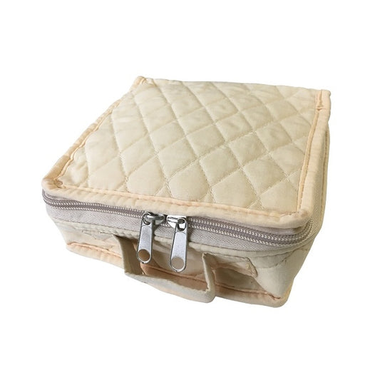 Square quilted beige pouch with a zipper and handle.