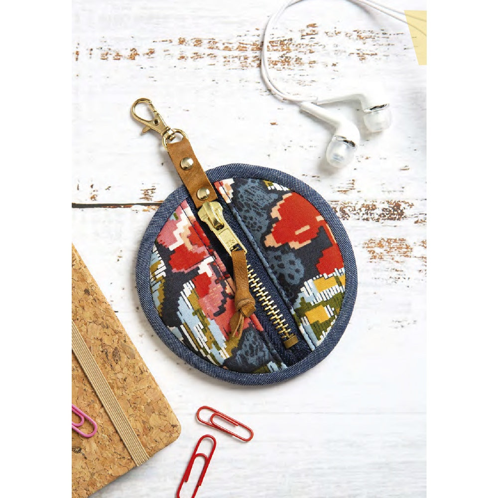 Round fabric zippered earbud case.