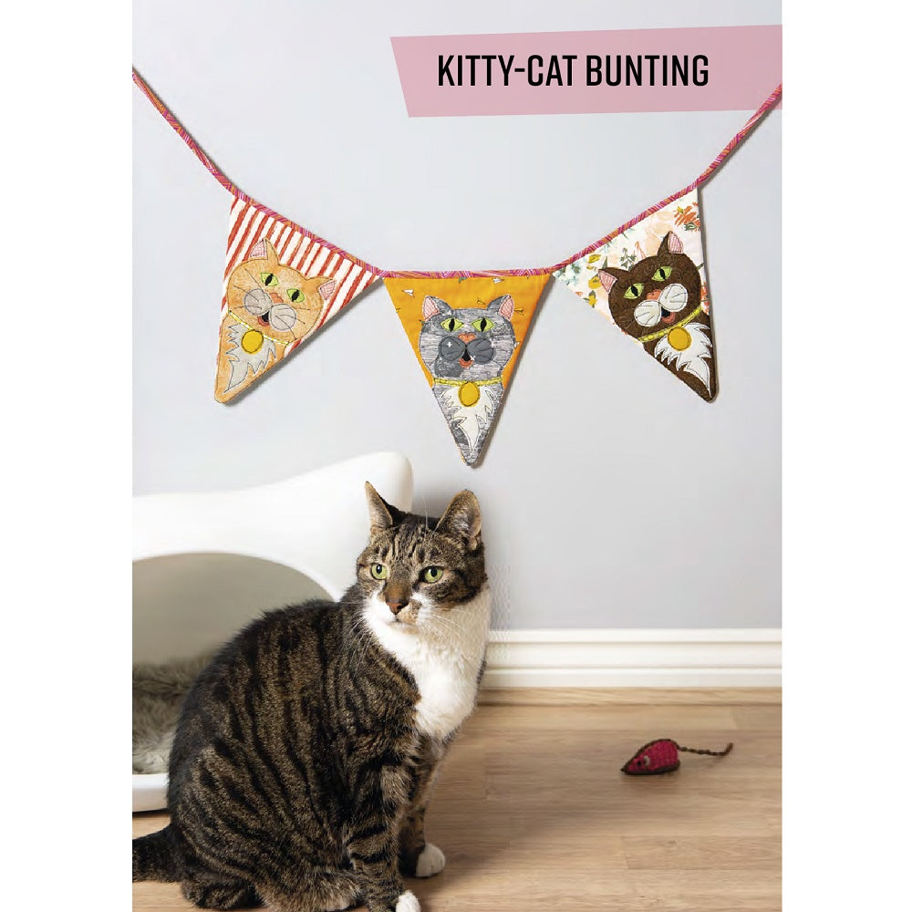 Fabric bunting with cat faces.