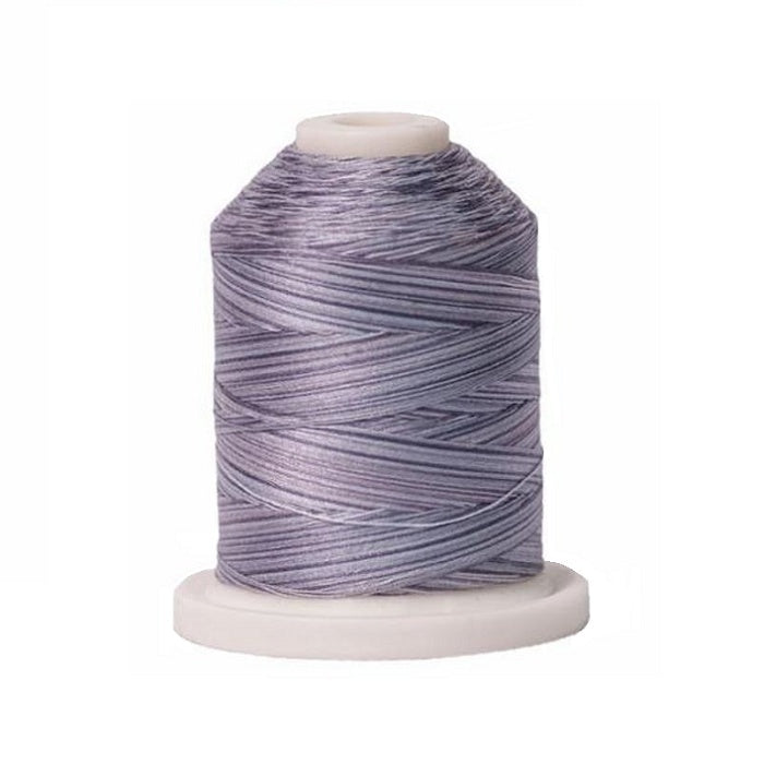 Mini king spool of grey variegated cotton thread.