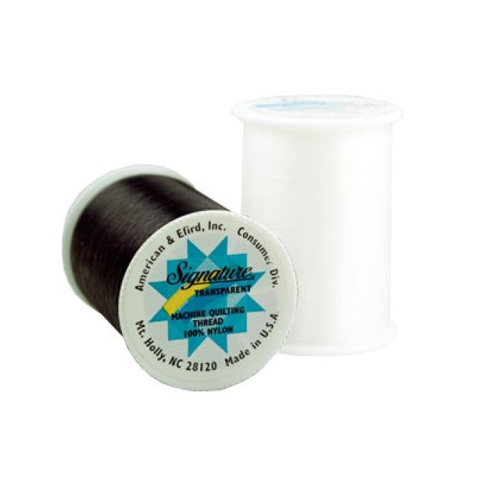 Two spools of thread with Signature branding.