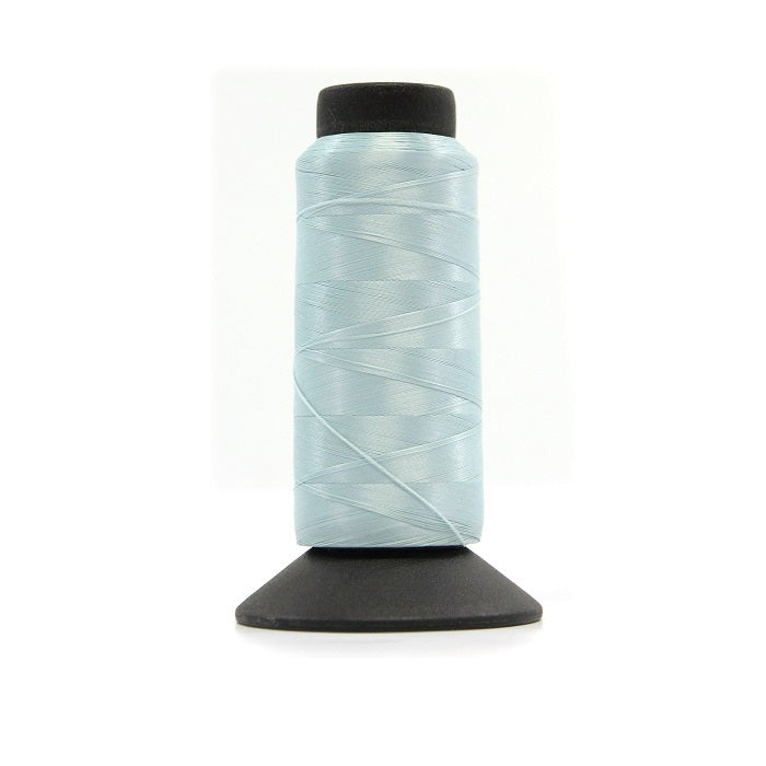 Cone of sky blue woolly nylon thread.
