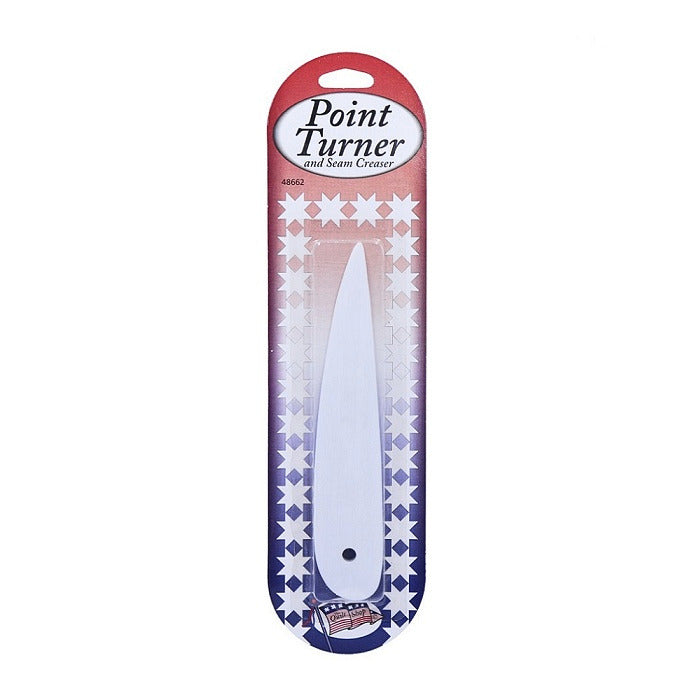 Packaged white plastic point turner.