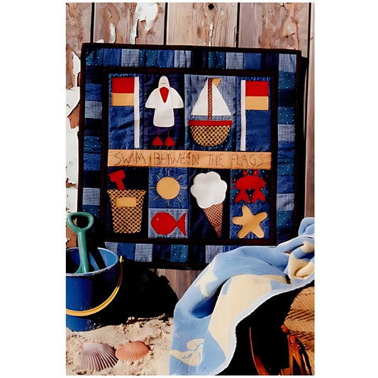 Patchwork quilt with seaside theme in blue, red and yellow.