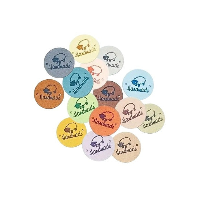 Collection of round tags with 'Handmade' text and sheep design.