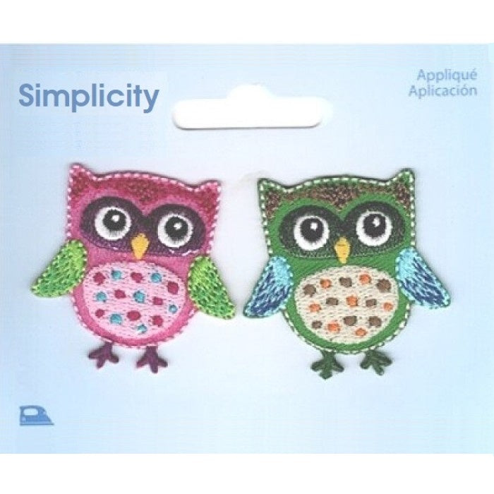 Two colourful owl appliques on a Simplicity brand card.