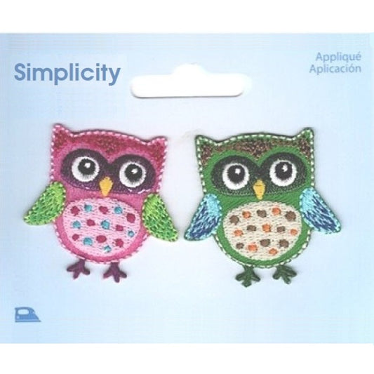 Two colourful owl appliques on a Simplicity brand card.
