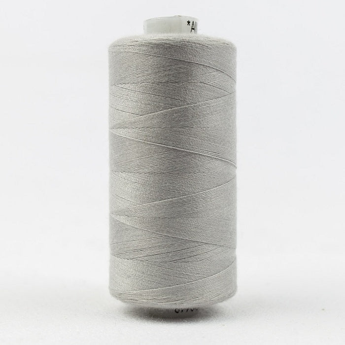 Spool of light grey thread with Designer branding.