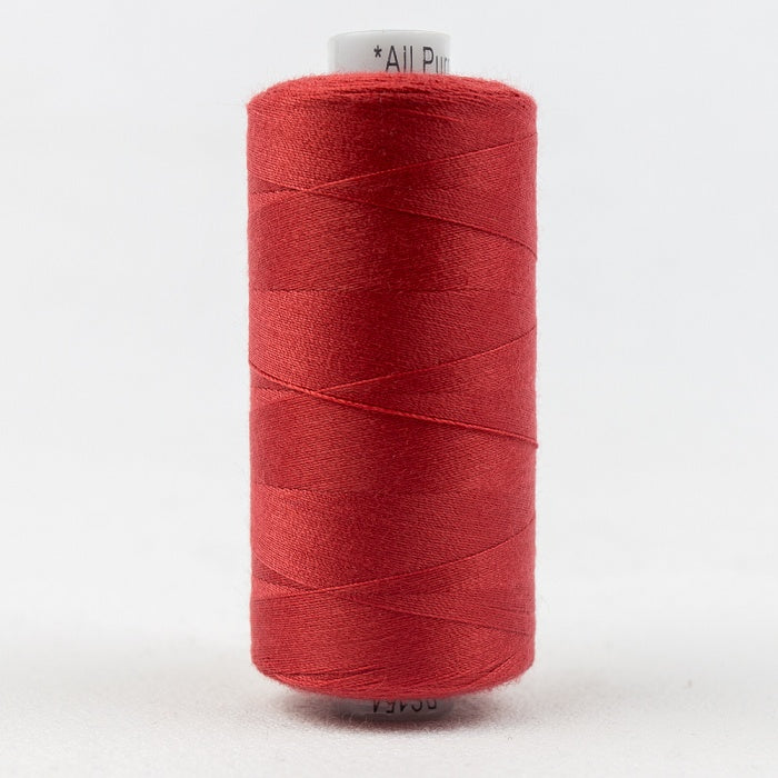 Spool of red thread with Designer branding.