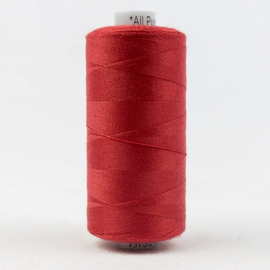 Spool of red thread with Designer branding.