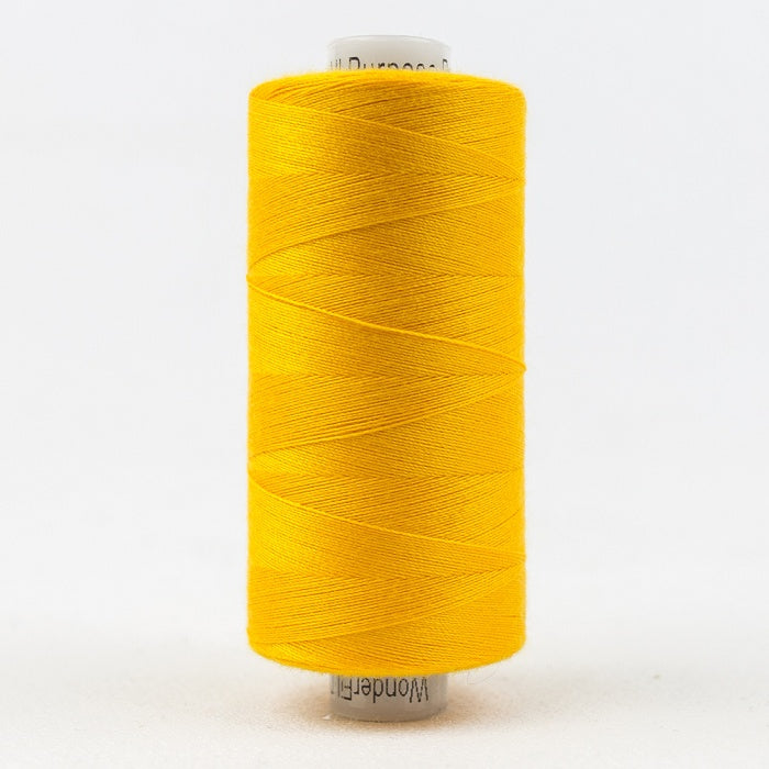 Spool of light orange thread with Designer branding.