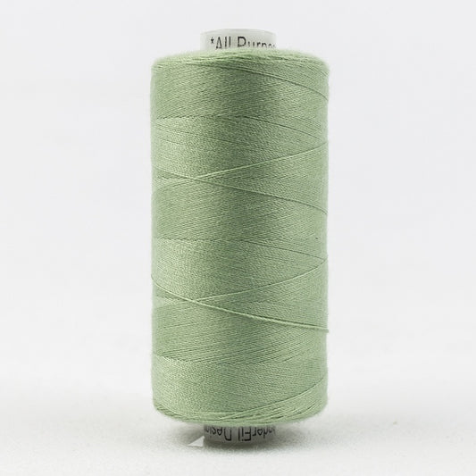 Spool of pale green thread with Designer branding.