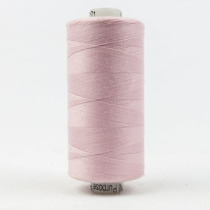 Spool of pale pink thread with Designer branding.