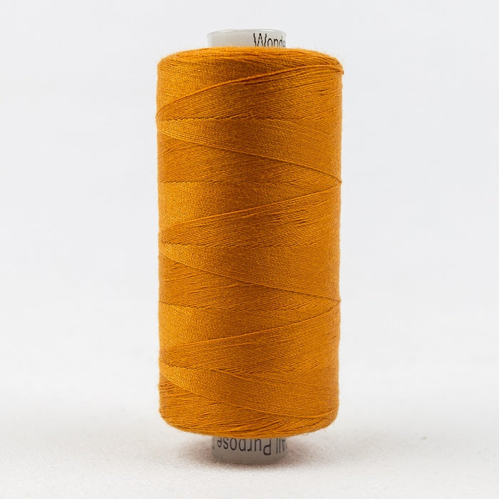 Spool of orange thread with Designer branding.
