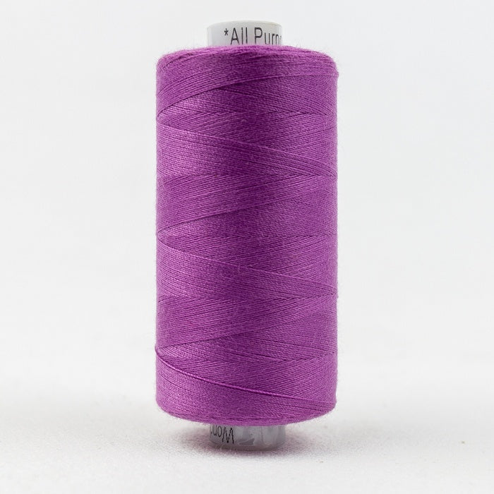 Spool of purple thread with Designer branding.