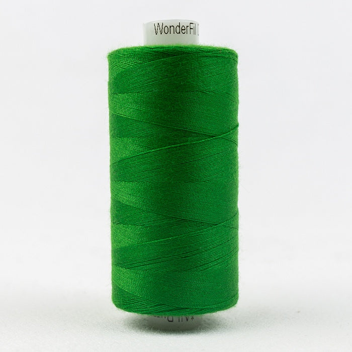 Spool of green thread with Designer branding.