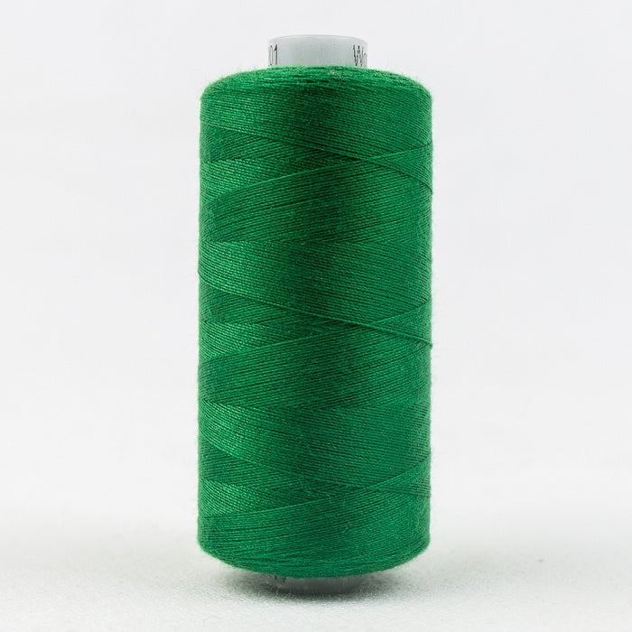 Spool of green thread with Designer branding.