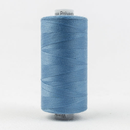 Spool of light blue thread with Designer branding.