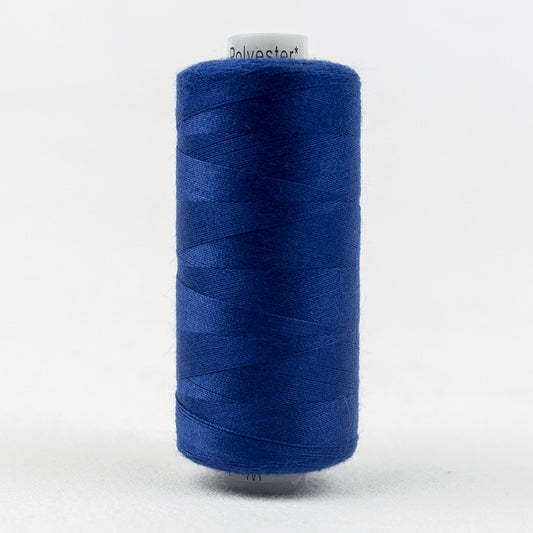 Spool of blue thread with Designer branding.