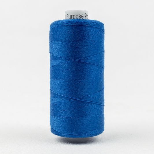 Spool of cobalt blue thread with Designer branding.