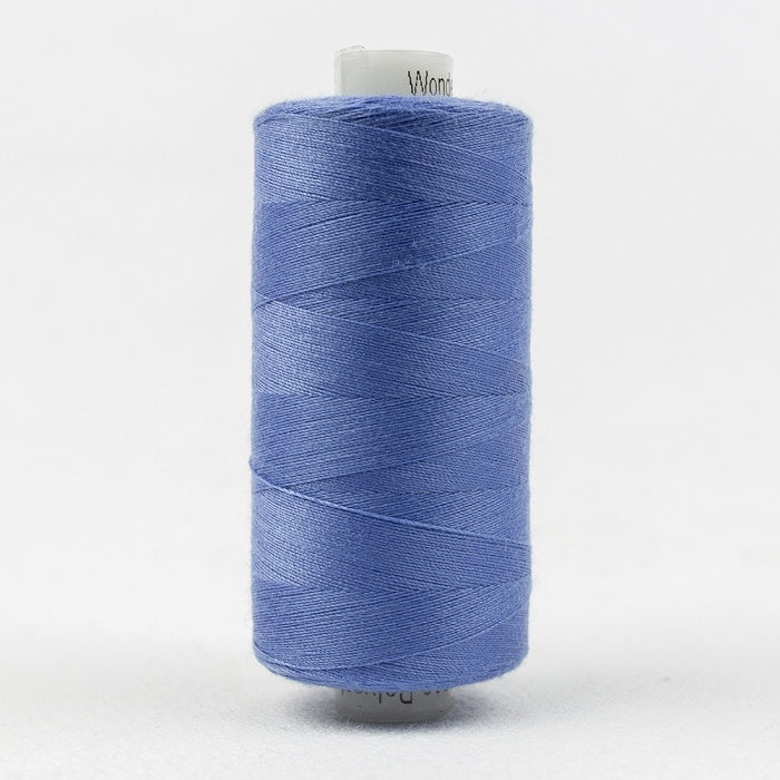 Spool of blue thread with Designer branding.