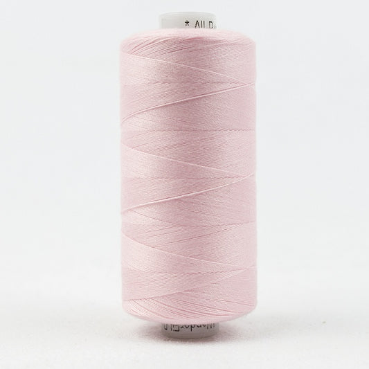 Spool of light pink thread with Designer branding.