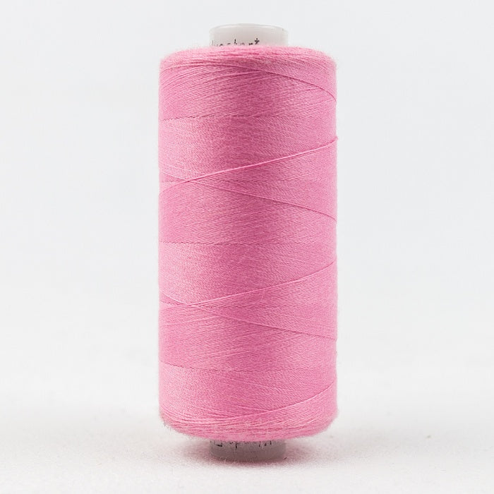 Spool of pink thread with Designer branding.