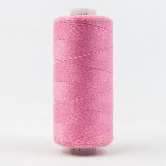 Spool of pink thread with Designer branding.