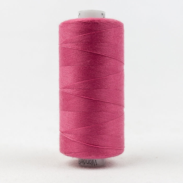 Spool of dark pink thread with Designer branding.