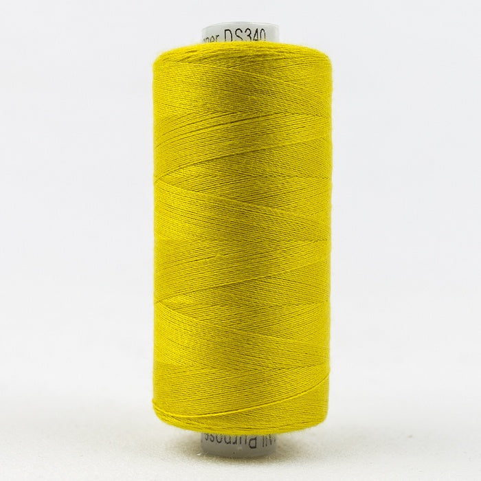 Spool of greenish yellow thread with Designer branding.