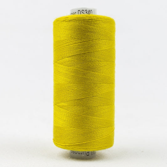 Spool of greenish yellow thread with Designer branding.